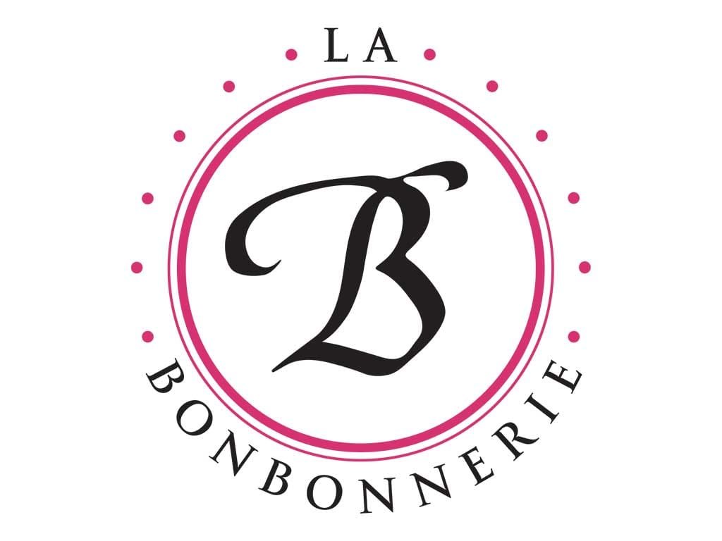 La Bonbonnerie logo, a script B inside a pink dotted circle