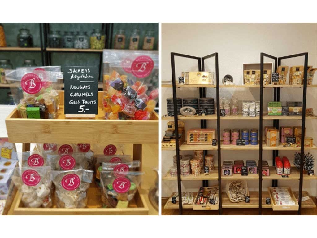 La Bonbonnerie candy bags with pink logo stickers and shop shelving